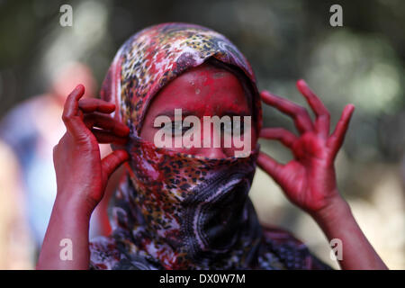 March 16, 2014 - A muslim student of Dhaka University Playing Holi.University students celebrate the festival of colour after smearing each other with coloured powder during Holi Festival in Dhaka, Bangladesh, 16 March 2014. Holi, which literally means 'burning', is celebrated on the full moon day in the month of Phalguna and heralds the onset of spring season (Photo by Zakir Hossain Chowdhury/NurPhoto) (Credit Image: Credit:  Zakir Hossain Chowdhury/NurPhoto/ZUMAPRESS/Alamy Live News Stock Photo