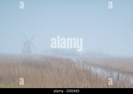 Dutch windmill in dense fog, Groningen, Netherlands Stock Photo
