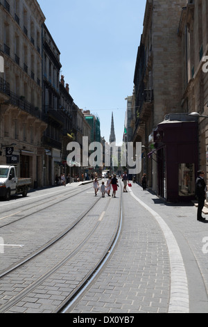 Tourists walking on a main street in Bordeaux France in view of the Cathedral Stock Photo