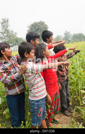 Indian Rural Kids Standing in farms Stock Photo