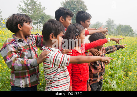 Indian Rural Kids Standing in farms Stock Photo