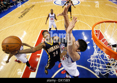 Philadelphia, Pennsylvania, USA. 16th Mar, 2014. March 14, 2014: Indiana Pacers forward Paul George (24) goes up for the shot while being double teamed by Philadelphia 76ers center Byron Mullens (30) and forward Thaddeus Young (21) during the NBA game between the Indiana Pacers and the Philadelphia 76ers at the Wells Fargo Center in Philadelphia, Pennsylvania. The Pacers won 101-94. Christopher Szagola/Cal Sport Media/Alamy Live News Stock Photo