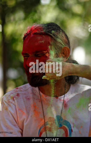 Dhaka, Bangladesh. 16th Mar, 2014. University students celebrate the festival of colour after smearing each other with coloured powder during Holi Festival in Dhaka, Bangladesh, 16 March 2014. Holi, which literally means 'burning', is celebrated on the full moon day in the month of Phalguna and heralds the onset of spring season (Photo by Mohammad Asad / Pacific Press) Credit:  PACIFIC PRESS/Alamy Live News Stock Photo