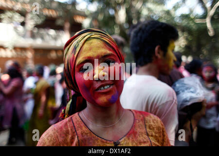 Dhaka, Bangladesh. 16th Mar, 2014. University students celebrate the festival of colour after smearing each other with coloured powder during Holi Festival in Dhaka, Bangladesh, 16 March 2014. Holi, which literally means 'burning', is celebrated on the full moon day in the month of Phalguna and heralds the onset of spring season (Photo by Mohammad Asad / Pacific Press) Credit:  PACIFIC PRESS/Alamy Live News Stock Photo