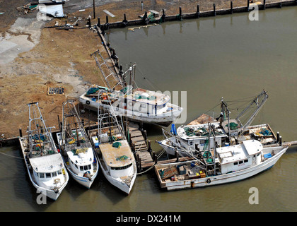 Damaged fishing boats thrown on shore by Hurricane Ike at a boatyard on the Bolivar Peninsula September 13, 2008 in Galveston, Texas. Hurricane Ike struck the Texas Gulf Coast as a strong Category 2 storm causing widespread damage to the region. Stock Photo