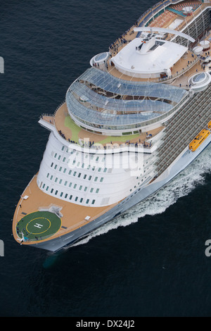 Aerial photo of Allure of the Seas, a cruise ship owned by Royal Caribbean sailing  towards the Storebaelt Bridge in Denmark. Stock Photo