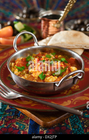 Menemen. Scrambled eggs with peppers and tomatoes. Turkish food Stock Photo