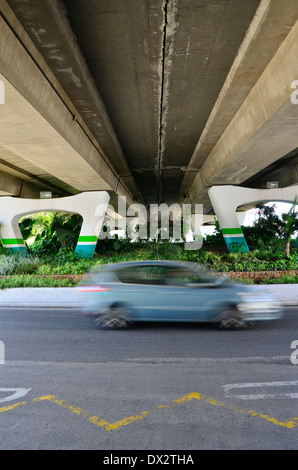 Roundabout under a highway bridge with vegetation, Spain. Stock Photo