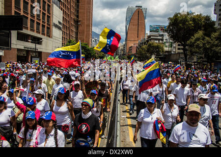 Caracas, Venezuela. 16th Mar, 2014. Thousands of Venezuelans marched to La Carlota Airbase in Caracas, on March 16, 2014 to express their disagreement with the meddling of the Cuba Government in the Venezuelans army. Later on, Altamira heats up, and the Bolivarian National Guard repress a group of protester and took the Plaza Francia of Altamira by assault, and a few got arrested. Credit:  Juan Manuel Hernandez/NurPhoto/ZUMAPRESS.com/Alamy Live News Stock Photo