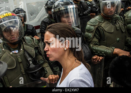 Caracas, Venezuela. 16th Mar, 2014. Thousands of Venezuelans marched to La Carlota Airbase in Caracas, on March 16, 2014 to express their disagreement with the meddling of the Cuba Government in the Venezuelans army. Later on, Altamira heats up, and the Bolivarian National Guard repress a group of protester and took the Plaza Francia of Altamira by assault, and a few got arrested. Credit:  Juan Manuel Hernandez/NurPhoto/ZUMAPRESS.com/Alamy Live News Stock Photo