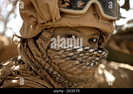 US Marine Cpl. Kofi Agyeman covered in road dust during a convoy through rugged terrain September 24, 2009 in Helmand province, Afghanistan. Stock Photo