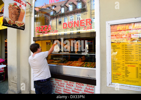 Overweight teen buys pizza Bamberg Germany Deutschland DE Bavaria UNESCO  Stock Photo - Alamy