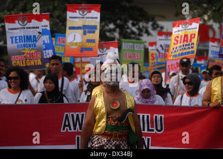 Central Java, Indonesia. 15th Feb, 2013. MARCH 15: A people with java costume called Semar take part on parade to mark opening of Indonesia election campaign in Indonesia on March 15, 2014 in Solo, Central Java, Indonesia. Indonesian elections will be held on April 9, 2014 while voting to Indonesia President election held July 9, 2014. Indonesia election followed by 12 parties with 180 million voters to take the part. © Sijori Images/ZUMAPRESS.com/Alamy Live News Stock Photo