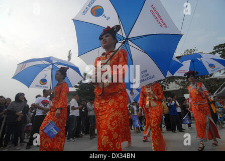 Central Java, Indonesia. 15th Feb, 2013. MARCH 15: Participant from the Nasdem Party take part on parade to mark opening of Indonesia election campaign in Indonesia on March 15, 2014 in Solo, Central Java, Indonesia. Indonesian elections will be held on April 9, 2014 while voting to Indonesia President election held July 9, 2014. Indonesia election followed by 12 parties with 180 million voters to take the part. © Sijori Images/ZUMAPRESS.com/Alamy Live News Stock Photo