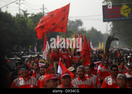 Central Java, Indonesia. 15th Feb, 2013. MARCH 15: Participant from the Indonesia Democratic Party of Struggle (PDIP) take part on parade to mark opening of Indonesia election campaign in Indonesia on March 15, 2014 in Solo, Central Java, Indonesia. Indonesian elections will be held on April 9, 2014 while voting to Indonesia President election held July 9, 2014. Indonesia election followed by 12 parties with 180 million voters to take the part. © Sijori Images/ZUMAPRESS.com/Alamy Live News Stock Photo