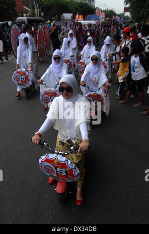 Central Java, Indonesia. 15th Feb, 2013. MARCH 15: Participant from Gerindra Party take part on parade to mark opening of Indonesia election campaign in Indonesia on March 15, 2014 in Solo, Central Java, Indonesia. Indonesian elections will be held on April 9, 2014 while voting to Indonesia President election held July 9, 2014. Indonesia election followed by 12 parties with 180 million voters to take the part. © Sijori Images/ZUMAPRESS.com/Alamy Live News Stock Photo