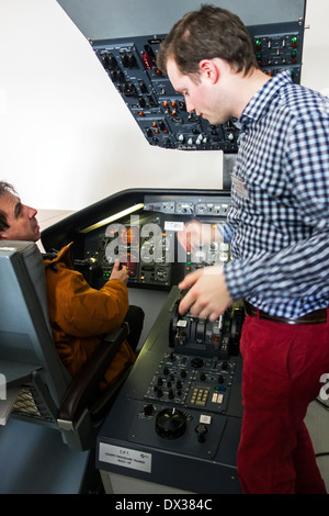 Student in CPT / mock-up cockpit procedure trainer at the VLOC / Flemish aviation training center in Ostend, Belgium Stock Photo