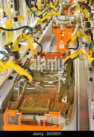 Robots in the underbody sealing and underbody coating station of the paint shop at Chrysler's Sterling Heights Assembly Plant. Stock Photo