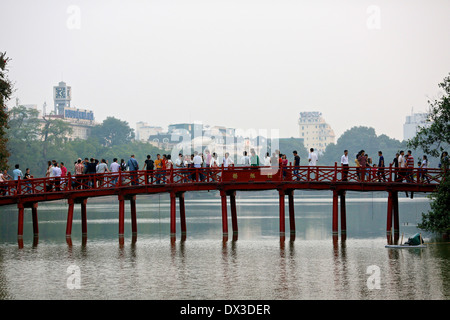 Crowds across the whole bridge to the Ngoc son Temple  on Hoan Kiem Lake. Hanoi, Vietnam, South East Asia Stock Photo