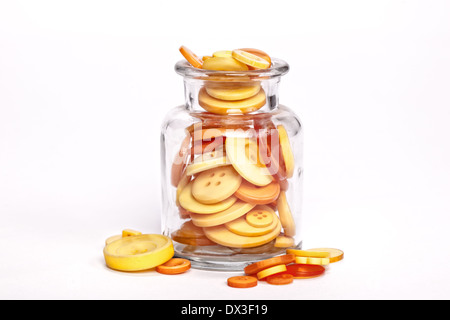Lot of Buttons in a jar on a white background Stock Photo