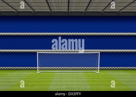 real grass and football goal posts with a computer generated stadium stand showing empty seats, Stock Photo