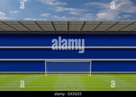 real grass,football goal posts and cloudy sky with a computer generated stadium stand showing empty seats, Stock Photo