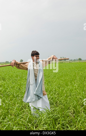 1 Indian Farmer Standing in Field Stock Photo