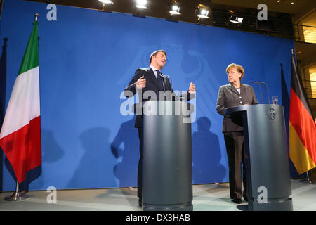 Berlin, Germany. 17th Mar, 2014. German Chancellor Angela Merkel (R) and Italy's Prime Minister Matteo Renzi attend a press conference at the Chancellery in Berlin, Germany, on Mar. 17, 2014. Merkel on Monday welcomed Italy's visiting new Prime Minister Matteo Renzi on his first official visit to Berlin for German and Italian government consultations since Renzi took office in February. Credit:  Zhang Fan/Xinhua/Alamy Live News Stock Photo