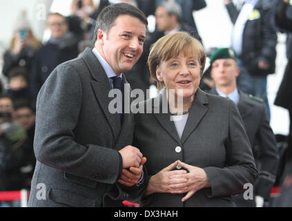 Berlin, Germany. 17th Mar, 2014. German Chancellor Angela Merkel (R) and Italy's Prime Minister Matteo Renzi attend a welcome ceremony at the Chancellery in Berlin, Germany, on Mar. 17, 2014. Merkel on Monday welcomed Italy's visiting new Prime Minister Matteo Renzi on his first official visit to Berlin for German and Italian government consultations since Renzi took office in February. Credit:  Zhang Fan/Xinhua/Alamy Live News Stock Photo