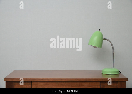 wooden Brown Table with a Lamp in bedroom Stock Photo