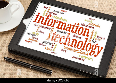 information technology word cloud on a digital tablet with a cup of coffee Stock Photo