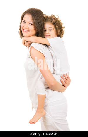 Happy mother offering piggy back ride to her daughter isolated on white background Stock Photo