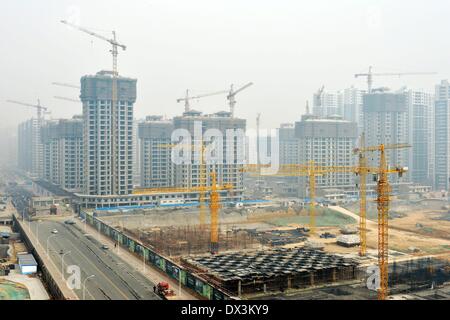 Shijiazhuang, China's Hebei province. 17th Mar, 2014. Buildings are under construction in Shijiazhuang, capital city of north China's Hebei province, March 17, 2014. Of a statistical pool of 70 major Chinese cities, 57 cities saw month-on-month rises in new home prices, fewer than 62 cities in January, the National Bureau of Statistics said in a statement on Tuesday. © Zhu Xudong/Xinhua/Alamy Live News Stock Photo
