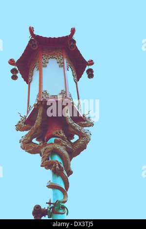 Chinatown ornate Chinese street lamp lantern with dragons, San Francisco, California, United States, toned image, low angle view Stock Photo