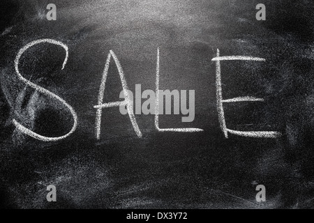 Handwritten message on a school chalkboard writing concept inscription, communication message, announcement Sale Stock Photo