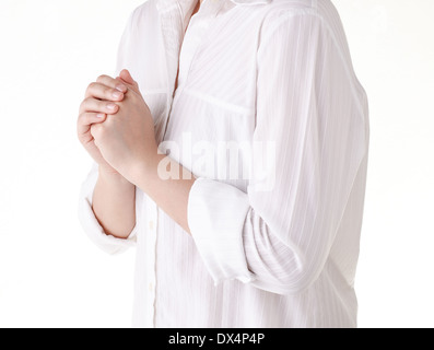 Woman praying isolated on white background Stock Photo