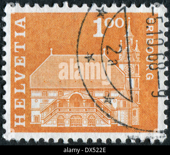 SWITZERLAND - CIRCA 1960: Postage stamp printed in Switzerland, shows the town hall in Fribourg, circa 1960 Stock Photo
