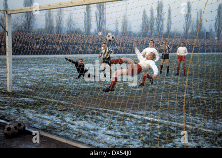 football, Regionalliga West, 1963/1964, Jahn Stadium, VfB Bottrop versus Rot Weiss Essen 1:1, overhead kick by Werner Kik (RWE) on the goalline, left keeper Bernd Brodbek (RWE) Stock Photo