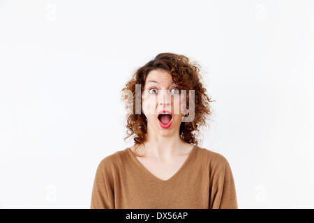 Young woman with a surprised expression Stock Photo