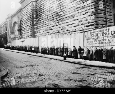 Bread line beside the Brooklyn Bridge approach between 1930 and 1935. Farm Security Administration Stock Photo
