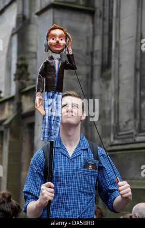 Puppeter at the Edinburgh Festival Fringe promoting the play A Matter Of Life And Death by King's College School (KCS) Theatre, Scotland, UK Stock Photo