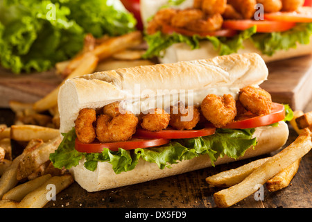 Homemade Shrimp Po Boy Sandwich with French Fries Stock Photo