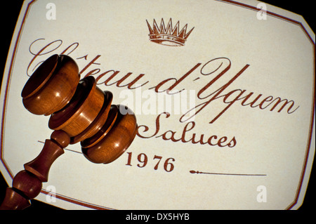 Old wooden auctioneers hammer on 1976 Chateau d'Yquem white wine label French Premier Cru Supérieur Sauternes Bordeaux France Stock Photo