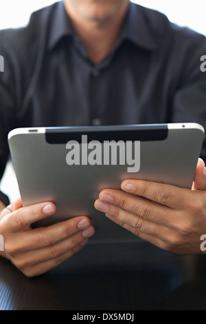 Man holding digital tablet, close up Stock Photo