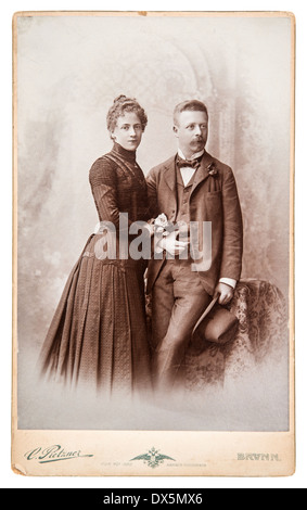 BERLIN, GERMANY - CIRCA 1880: antique family portrait man and woman wearing vintage clothing, circa 1880 in Berlin, Germany