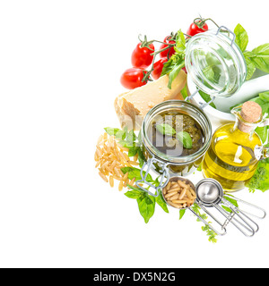 ingredients for fresh green pesto sauce on white background. Stock Photo