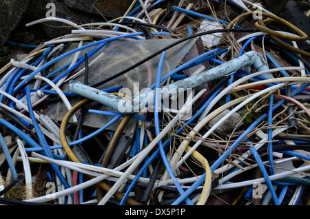 Building rubble from disused factory knocked down - actually showing piping and cabling. Stock Photo