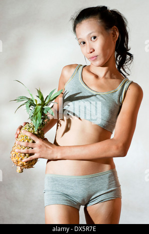 little purenudism model asian young Asian body shape model with pineapple in studio setting Stock Photo -  Alamy