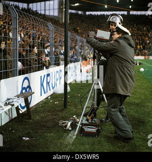 football, Bundesliga, 1977/1978, Stadium an der Castroper Strasse, VfL Bochum versus Borussia Dortmund 1:0, video control of the football fans by policemen Stock Photo