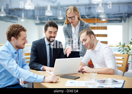 Business team sharing interesting ideas at meeting Stock Photo